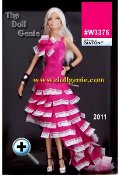 This Barbie is all about pink, particularly PMS 219, her signature color. This glamorous dress celebrates that fashion heritage with a long full skirt made of pantone color chips in PMS 219. The  leather bodice, also in matching pink, is sleek and fitted with two straps and a flower accent of pantone chips. White shoes, with PMS 219 written on them, silvery and black bangles and silver hoop earrings complete the look. Pink has never looked so pretty. 