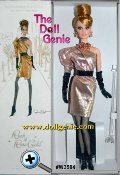 Striking and sophisticated, Rush of Rose Gold Barbie doll is stunning in an asymmetrical dress of glamorous golden lame. A single dolman sleeve makes a bold statement, while the wrap skirt falls just above her knees, adding to the modern silhouette. The black vinyl belt, hose and boots offer elegant contrast, while rose-golden accessories add the final stylish touch. Limited Platinum Edition by Robert Best - Because this is a BC Exclusive doll, this doll was only available to us through resale and is priced accordingly. Less than 1000 of these dolls worldwide. 